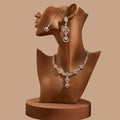 Luxury Rose Gold jewelry set with pink accents displayed on a studio mannequin.