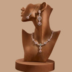 Luxury Rose Gold jewelry set with pink accents displayed on a studio mannequin.