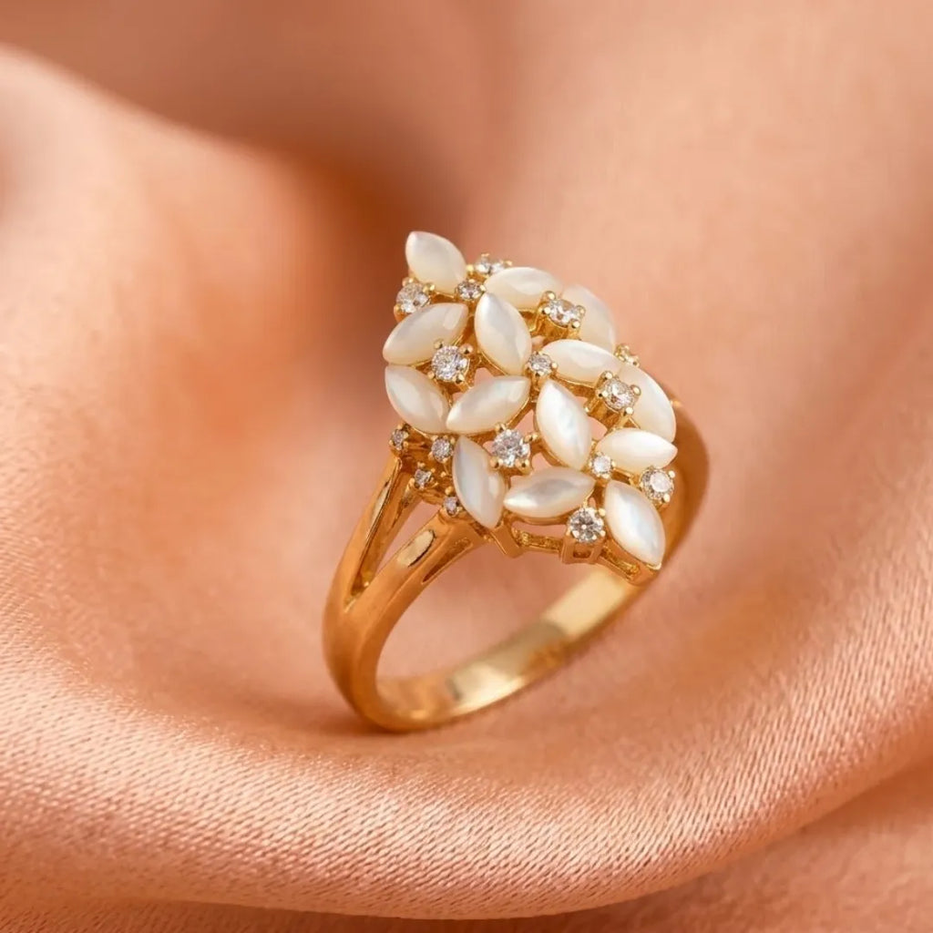 Elegant gemstone statement ring worn by a model, styled with a formal white outfit.