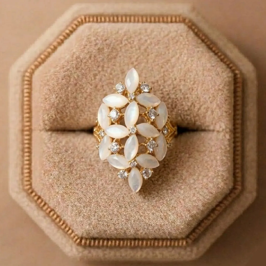 Decorative ring with white stones on a beige cushioned stand