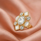 Modern double-stone golden ring worn by a model, styled for a high-end luxury event.