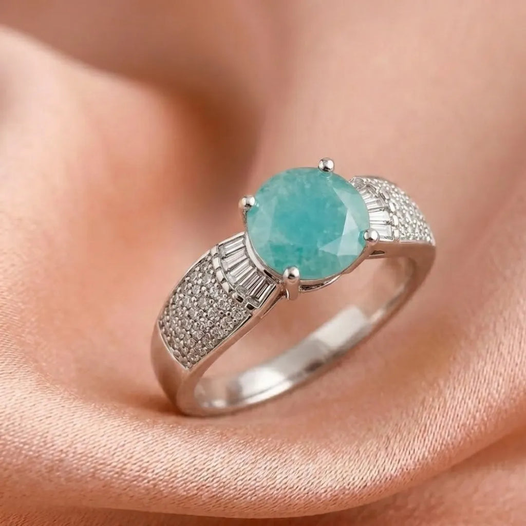 Silver ring with a turquoise gemstone on a skin background